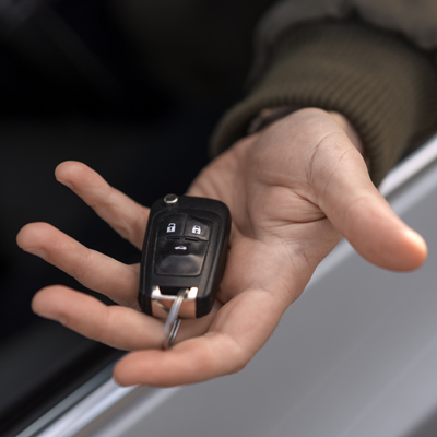 Vital Auto keys hand open holding a car key Vital Auto keys hand open holding a car key